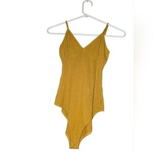 7/87. Forever 21 Mustard  Bodysuit(PRICE IS FIRM IF YOUR JUST BUYUNG THIS ITEM)